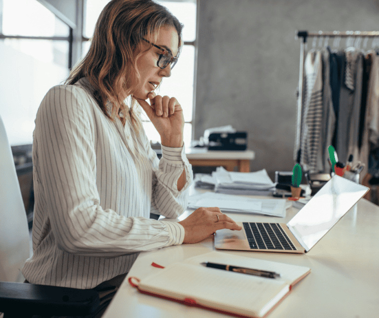business owner on computer testing AI search
